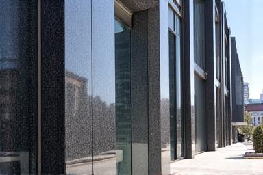 Clean and glossy granite building facade after professional restoration